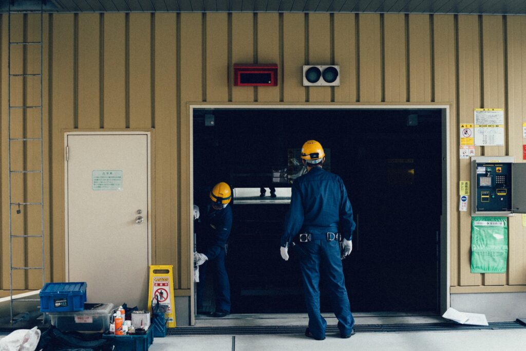 worker setting up a garage door